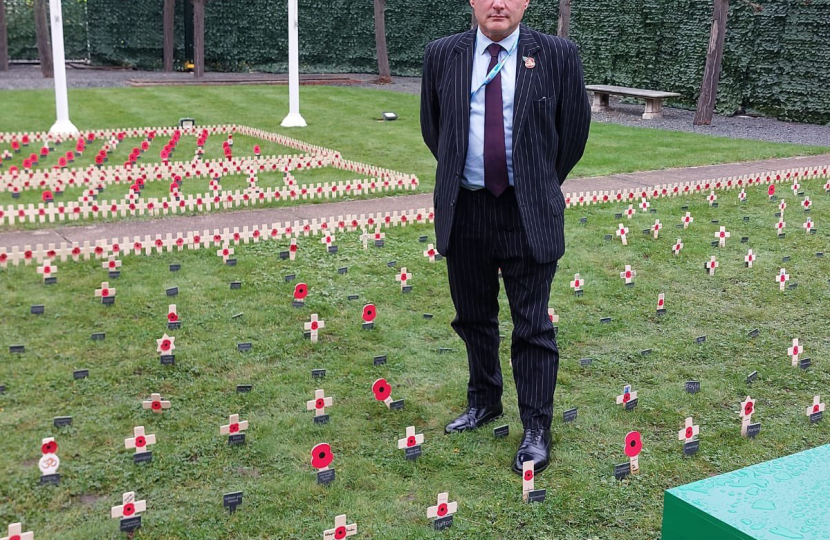 Jack Lopresti MP standing by the Filton and Bradley Stoke Tribute in the Garden of Remembrance..