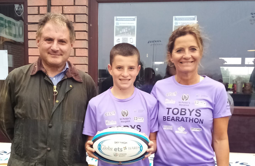 Jack at Clifton Rugby game with Toby, who is fundraising for St Peter's Hospice, and his mum Claire.