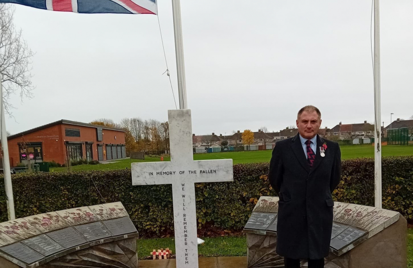 Jack Lopresti MP standing at Patchway War Memorial