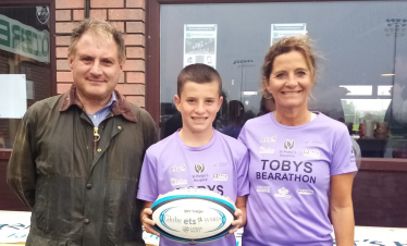 Jack at Clifton Rugby game with Toby, who is fundraising for St Peter's Hospice, and his mum Claire.